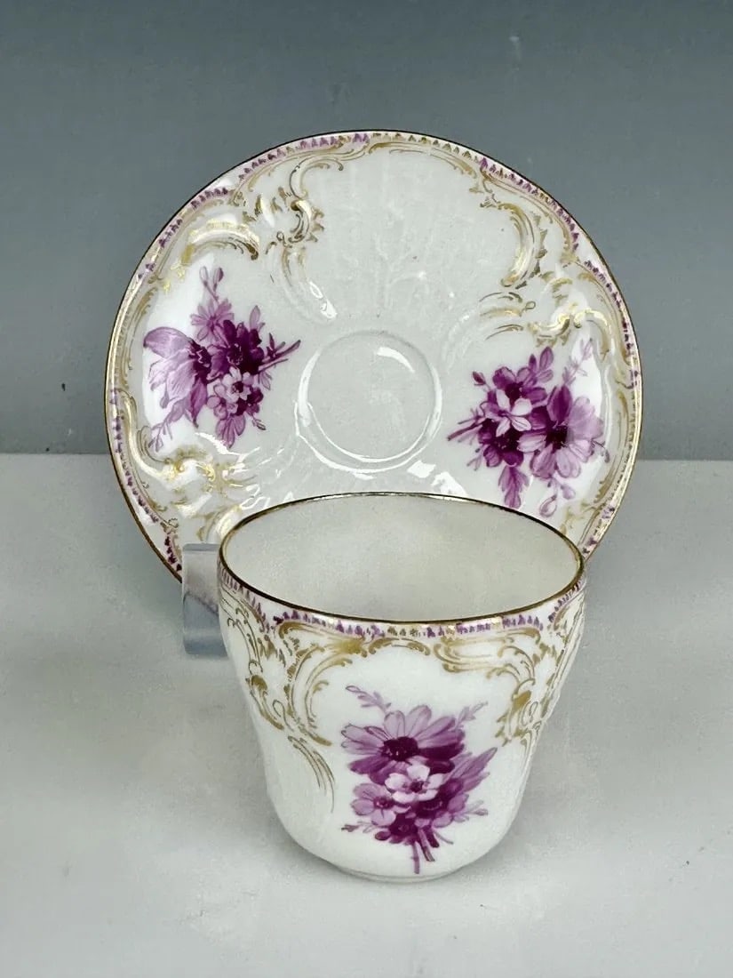 19TH C. BERLIN KPM DEMITASSE CUP AND SAUCER: Stamped with scepter mark and red orb mark. Excellent condition. Estimate $500-600