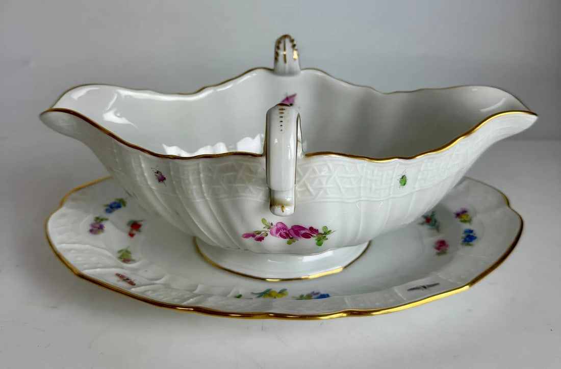 MEISSEN SAUCEBOAT: Circa 1900. Measures 8.5 inches l. In mint condition. Estimate $800-1000