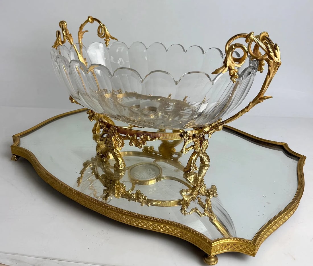A LARGE ORMOLU MOUNTED BACCARAT CENTERPIECE: Circa 1900. With an ormolu bade. Measures 22 inches x 17 inches . Stamped Baccarat. In excellent condition.Estimate $5000-6000