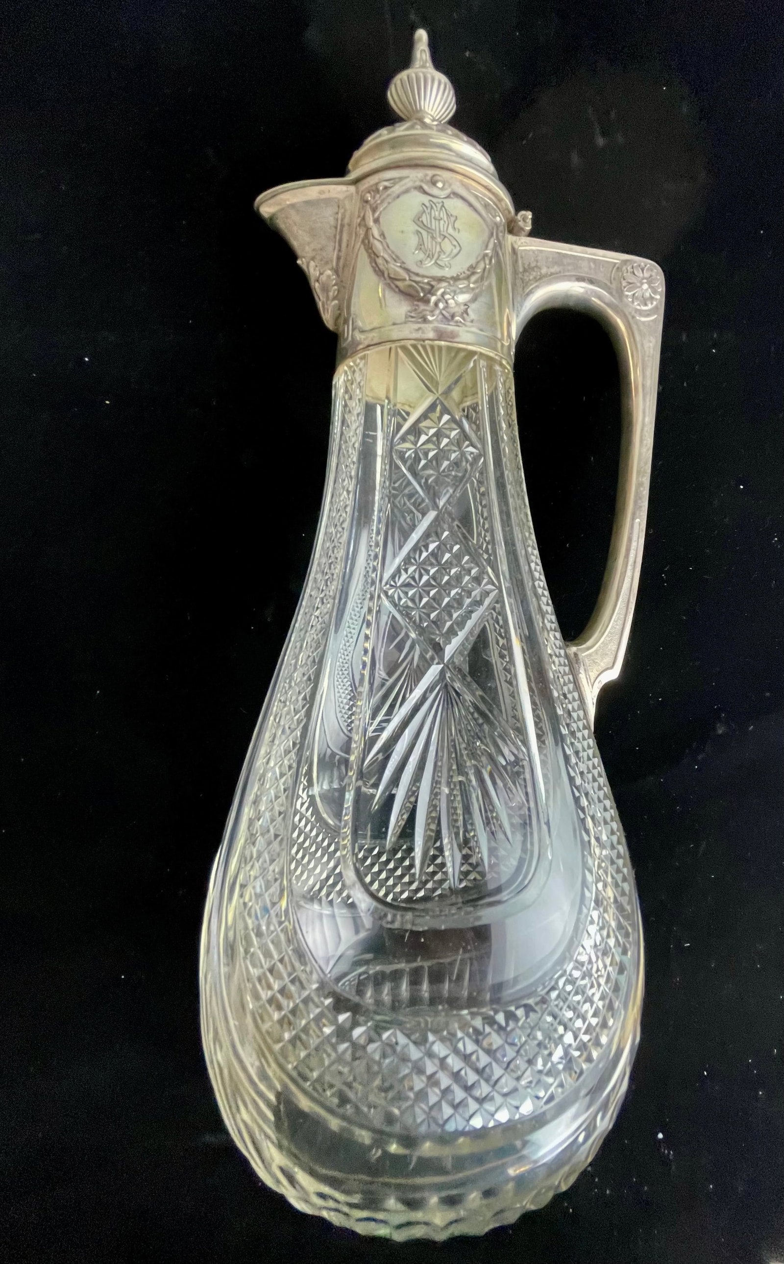 19TH C. CONTINTAL SILVER AND CUT GLASS LIQUOR BOTTLE: Measures 14” h. In excellent condition. Estimate $1500-2000