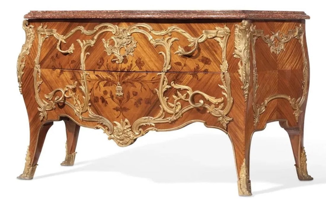 A FRENCH ORMOLU-MOUNTED KINGWOOD AND TULIPWOOD MARQUETRY COMMODE: AFTER THE MODEL BY B.V.R.B., LATE 19TH CENTURYThe serpentine red cippolino marble top above a pair of drawers inlaid and mounted sans traverses with floral marquetry, the sides similarly decorated, th