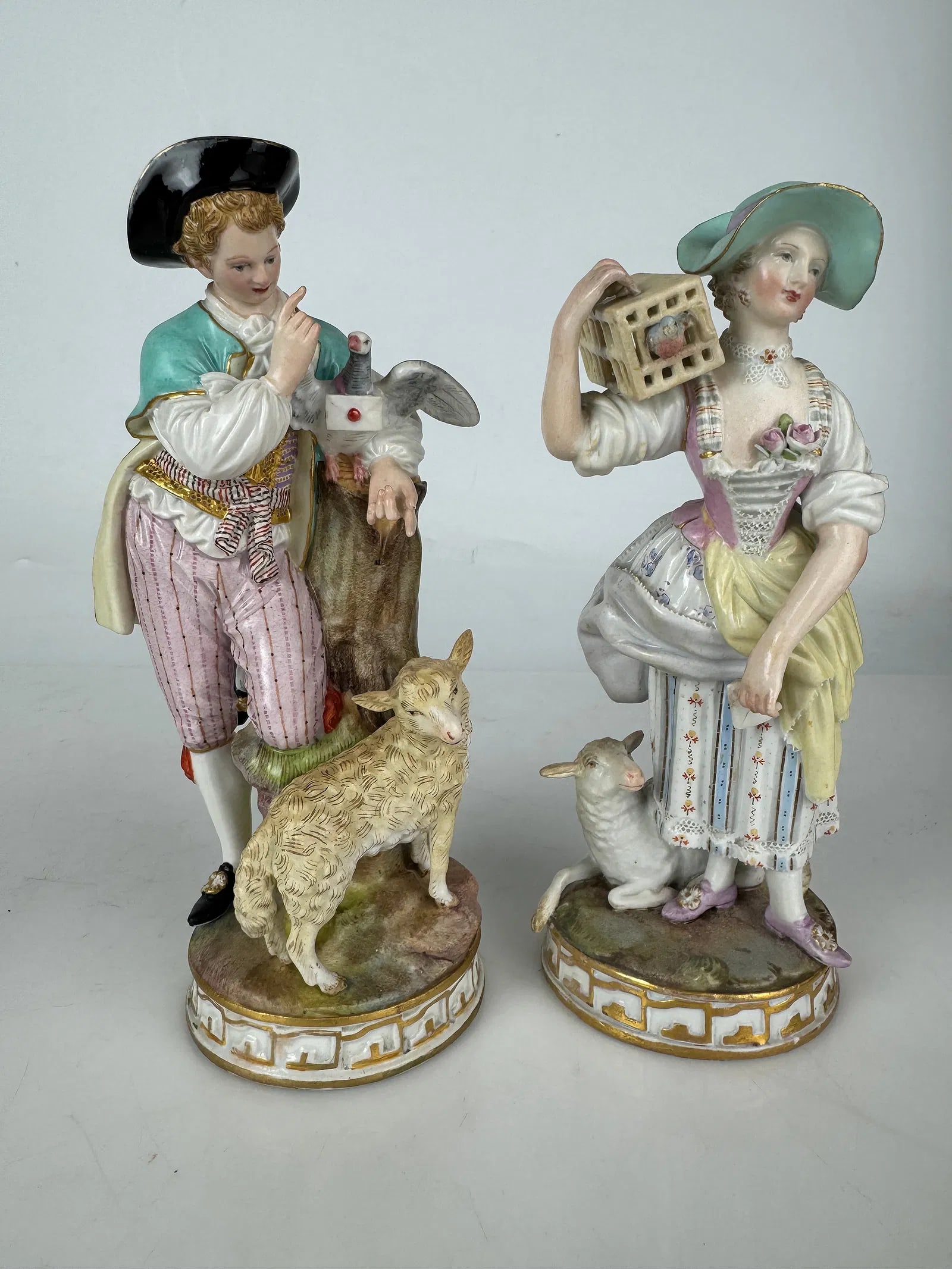 A PAIR OF 19TH C. MEISSEN PORCELAIN FIGURES: First quality cross swords marks. Measure 7 inches high. Estimate $1200-1500