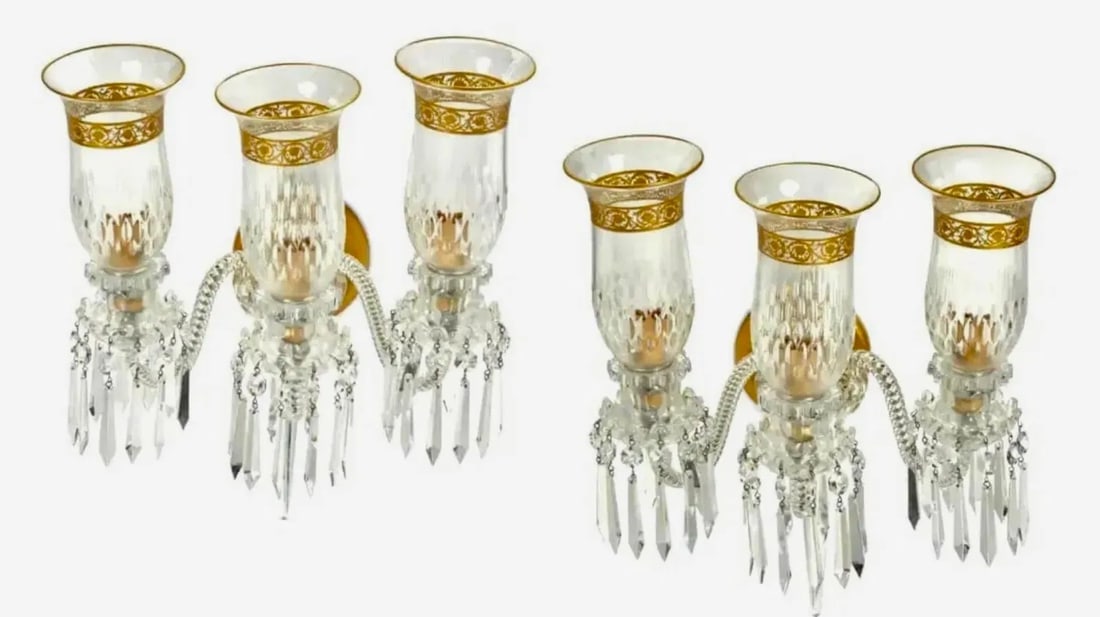 A PAIR OF ST. LOUIS THISTLE PATTERN 3 LIGHTS WALL SCONCES: A pair of St. Louis gilt glass "Thistle" wall sconces20th centuryEach three-light sconce with faux candle fixtures on molded glass bases with draping prismatic tear drops and glass shades with banded