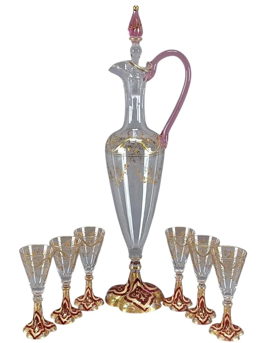 A MAGNIFICENT ENAMELED MOSER LIQUOR SET: Circa 1900 The decanter measures approximately 3 3/4 inches wide including the handle x 13 inches tall to the top of the stopper.The cordials each measure approximately 1 3/8 inches wide x 3 1/2