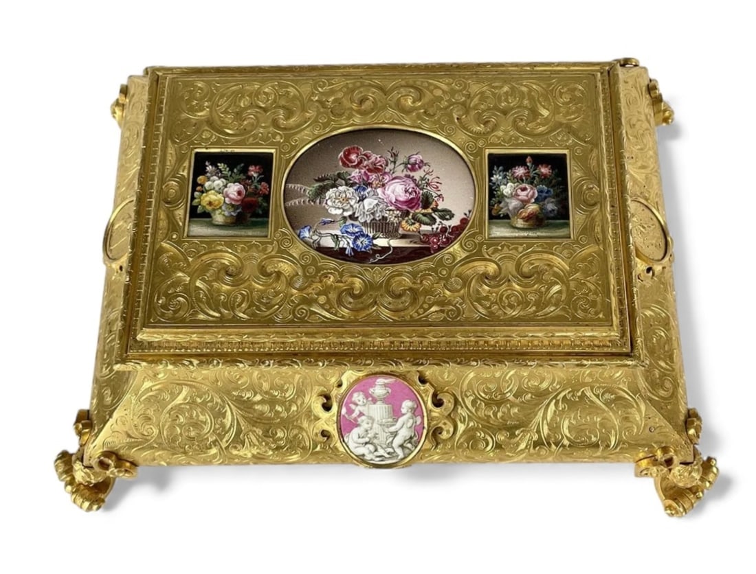A MAGNIFICENT MICRO MOSAIC MOUNTED ORMOLU BOX: Circa 1900. Measures 10x8x5 inches tall. Inset with 2 magnificent micro mosaic panels and enamel panels. Excellent condition. Estimate $15.000-20.000