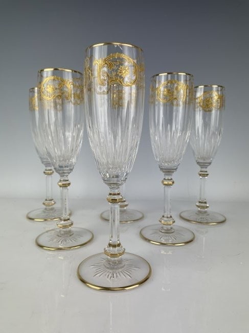 SET OF 6 SIGNED BACCARAT CUT CRYSTAL CHAMPAGNE COUPS: Measure 8.25 inches tall. All in excellent condition. All with acid etched Baccarat marks.Estimate $2.500-3.000