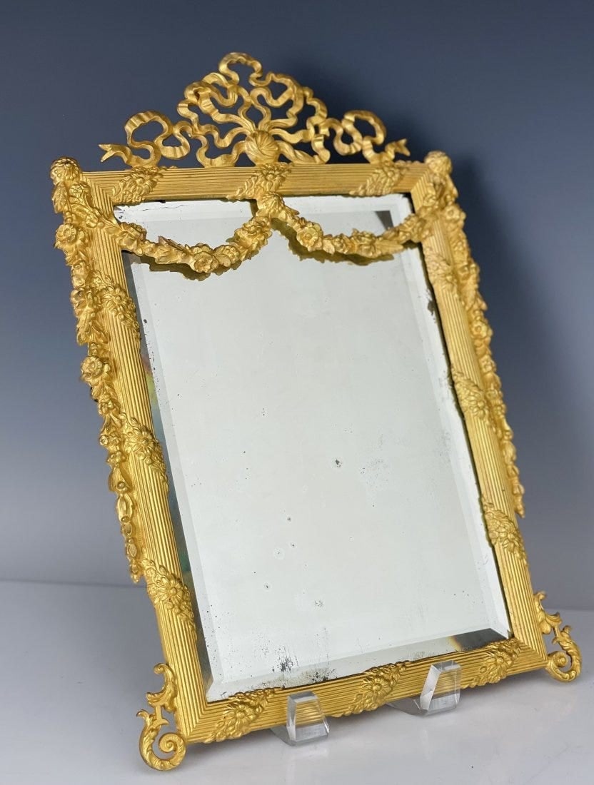 A LARGE DORE BRONZE MIRROR: Circa 1900. Measures 11 x8 inches. Good condition. Estimate $800-1.000