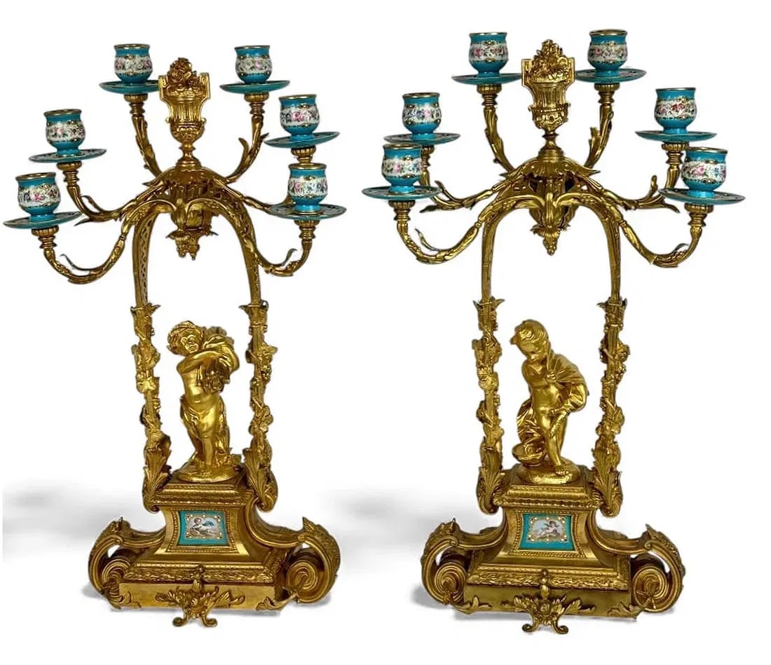 A MAGNIFICENT ORMOLU MOUNTED SEVRES CANDELABRA: Circa 1900. Measure 24 inches high. In perfect condition. Estimate $5000-6000