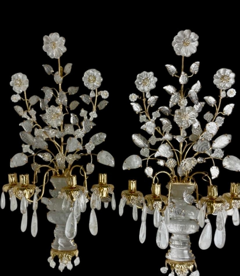 AN IMPOSING PAIR OF 4 LIGHT ORMOLU AND ROCK CRYSTAL WALL LIGHTS: VERY FINELY CARVED ROCK CRYSTALAND ORMOLU. MEASURES 34 inches H. In excellent condition.Estimate $6000-8000