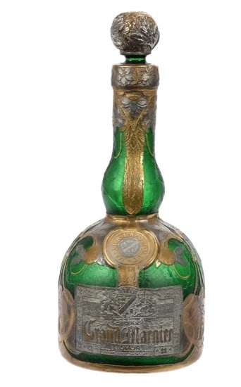 DAUM NANCY. CAMEO GLASS GRAND MARNIER BOTTLE: Circa 1900. Measures 8.5 inches high. In good used condition. Estimate $2.000-2.500