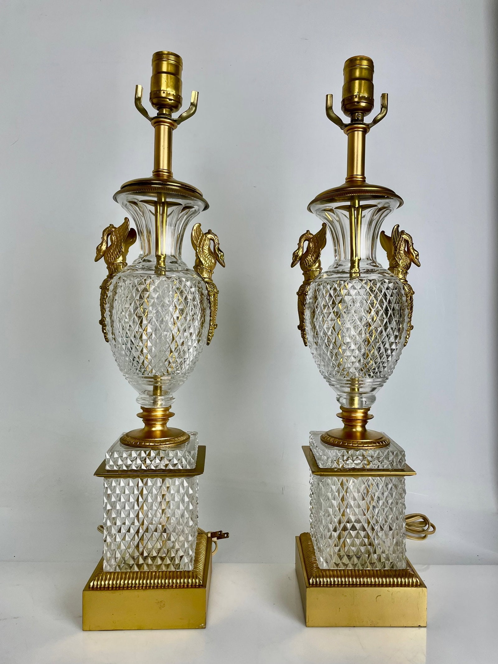 ORMOLU MOUNTED BACCARAT CRYSTAL LAMPS: Measure 23 inches high. In good condition. Estimate $2500-3000