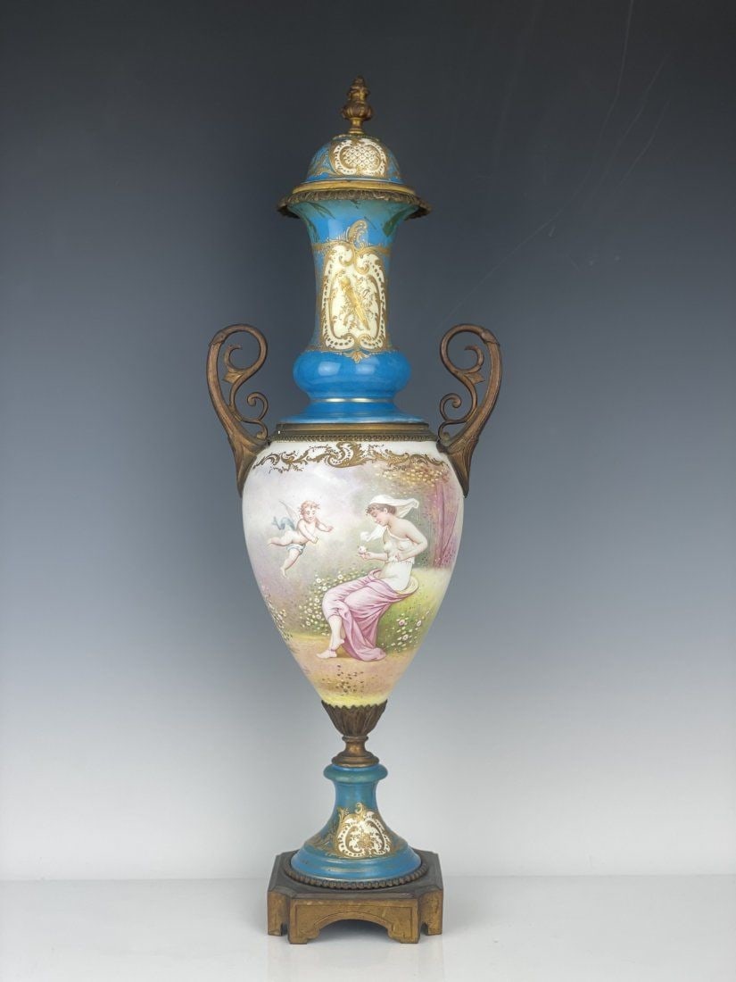 ORMOLU MOUNTED SEVRES PORCELAIN VASE: Circa 1900. Measures 23 inches tall. In overall good condition, small firing crack in the lid.Estimate $800-1.000