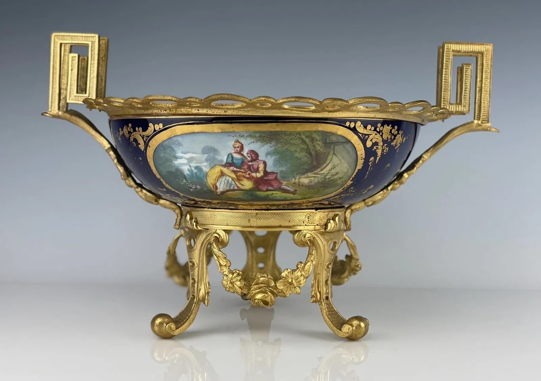 19TH C. ORMOLU MOUNTED SEVRES CENTREPIECE: Measures 14 inches w., 10 inches h. In good perfect condition. Estimate $800-1000