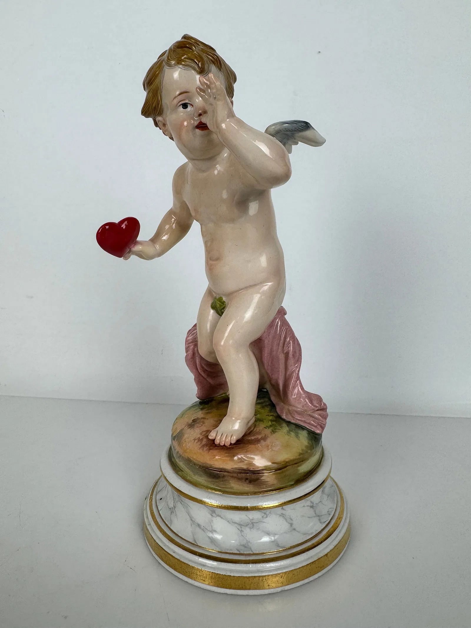 MEISSEN CHERUB L SERIES: Circa 1900. First quality mark. Measures 8 inches h. In excellent condition. Estimate $1000-1200