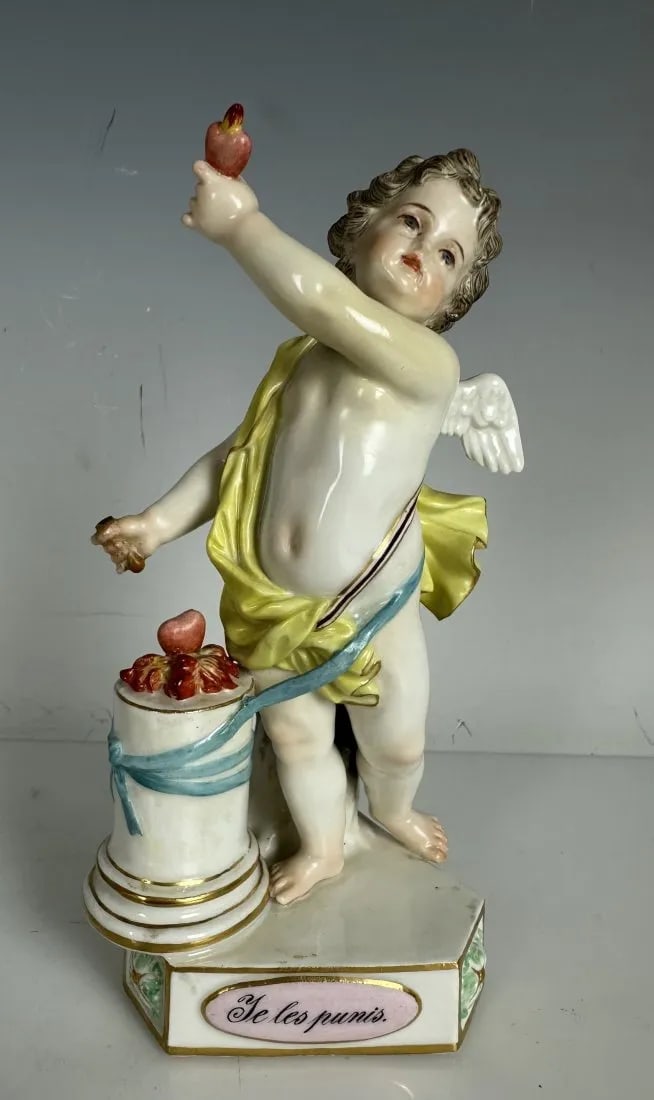 19TH C. MEISSEN MOTO CHERUB: First quality cross swords mark. Measures 5.5 inches high. In overall good antique condition.Estimate $800-1.000