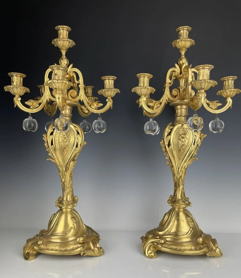 A PAIR OF DORE BRONZE & BACCARAT CRYSTAL CANDELABRA: Circa 1880. Measures 24 inches tall. In good condition. Estimate $2.500-3.000