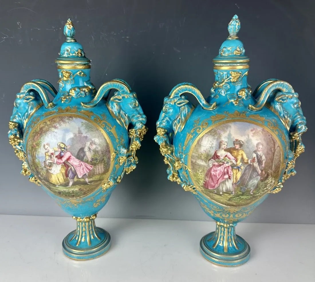 A PAIR OF SEVRES PORCELAIN VASES: Circa 1800. Measure 16 inches high. Overall good condition. Estimate $2.000-2.500