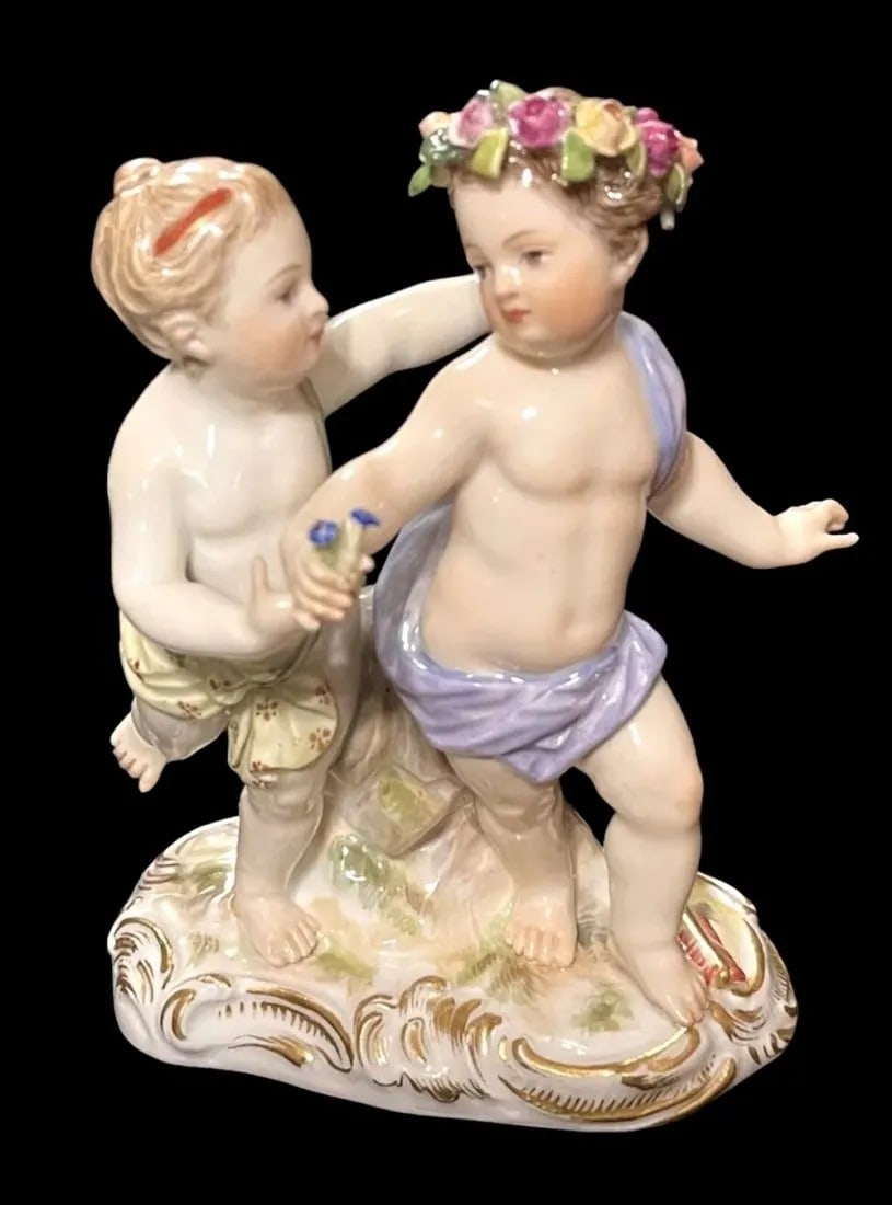 19TH C. MEISSEN GROUP OF DANCING CHERUBS: First quality cross swords mark. Measures 3.5 l., 4.5 inches high. In good antique condition.Estimate $1.000-1.200