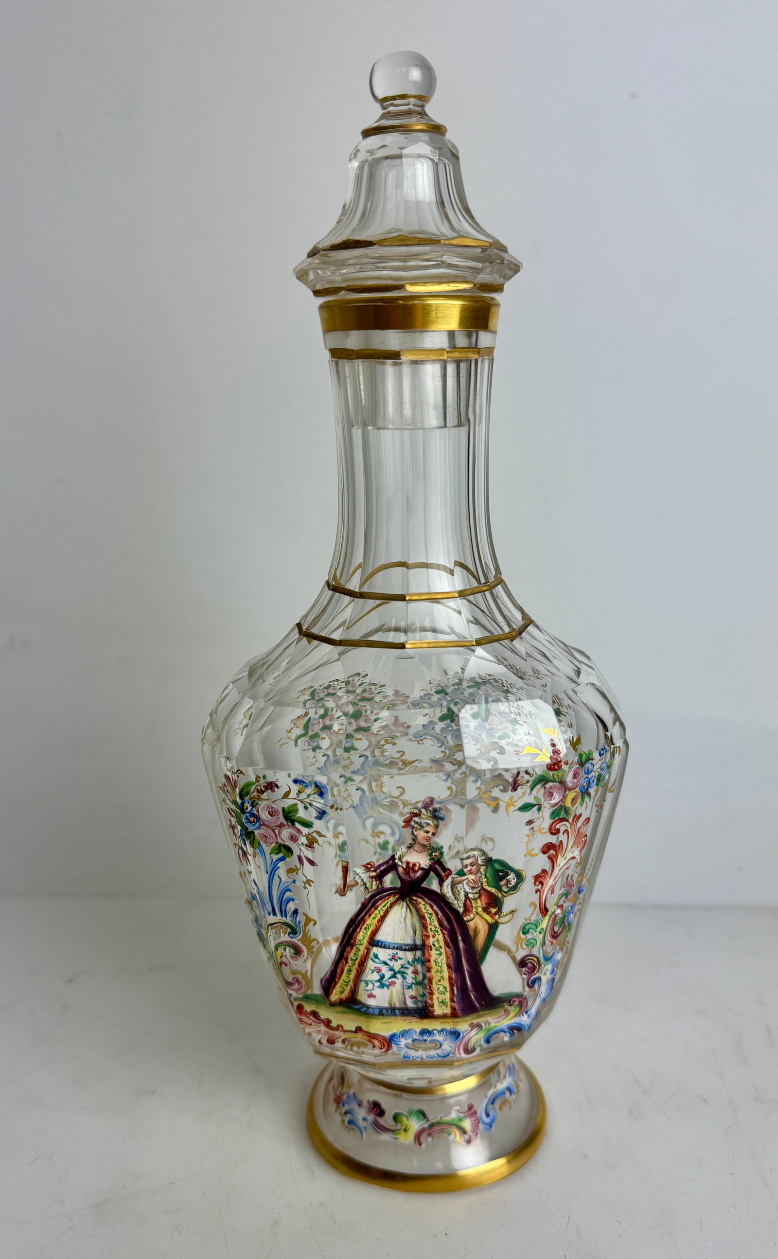 A LARGE ENAMELED LOBMEYR LIQUOR BOTTLE: Circa 1900. Measures 10.5” h. Signed. In excellent condition. Estimate $1500-2000
