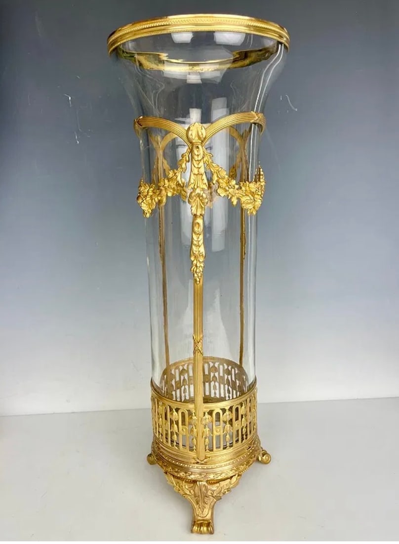 A LARGE ORMOLU MOUNTED BACCARAT GLASS VASE: Circa 1900. Measures. 16” tall x 5-7/8” wide at top, 5-1/2” at bottom (including feet)..In excellent condition. Estimate $1500-2000