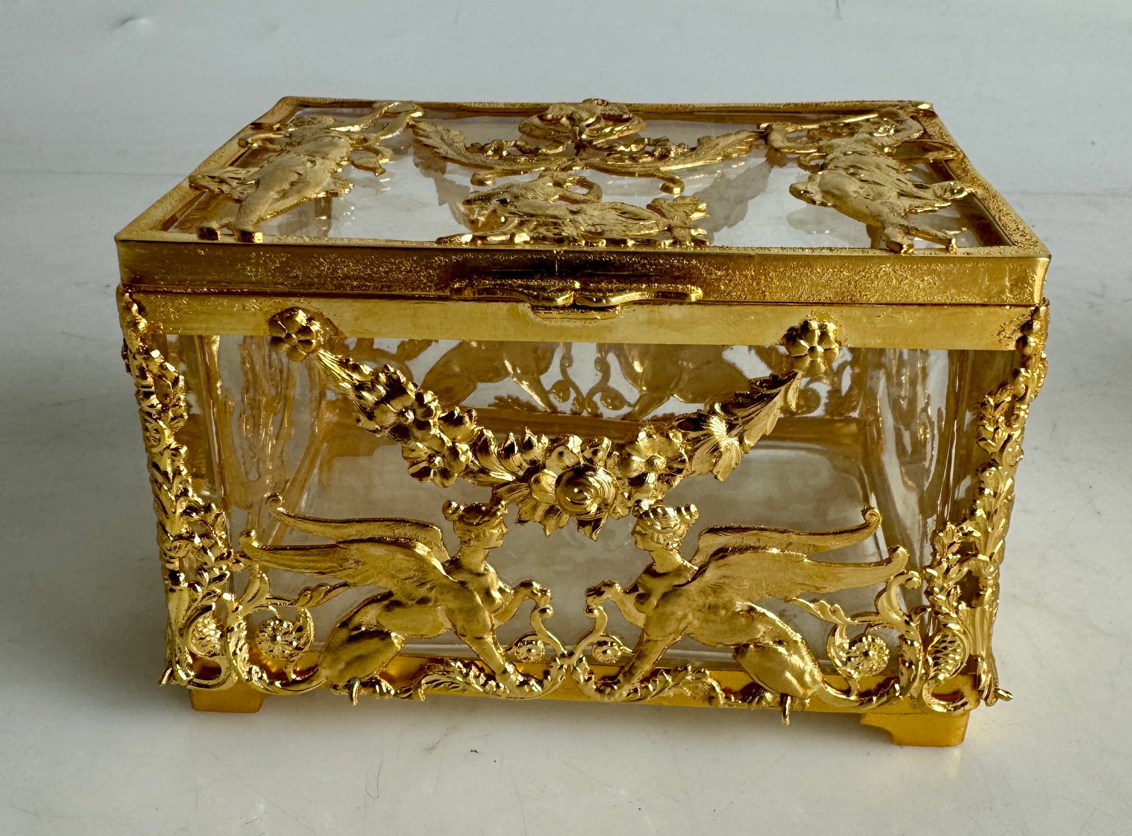 A MAGNIFICENT EMPIRE STYLE ORMOLU MOUNTED BACCARAT BOX: Circa 1900. Measures 4”x4”x5”h. In excellent condition. Estimate $1200-1500