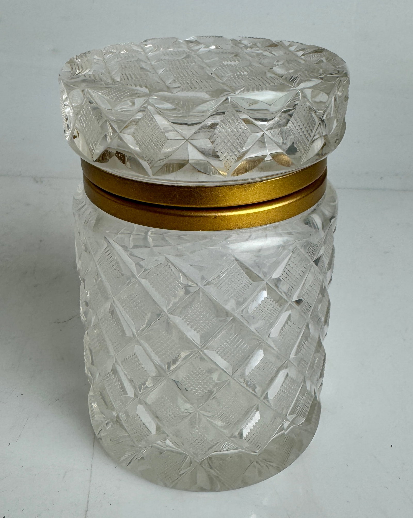 ORMOLU MOUNTED CUT CRYSTAL ROUND BOX: Circa 1930. Measures 3” d., 5.5” h. In good condition. Estimate $600-800