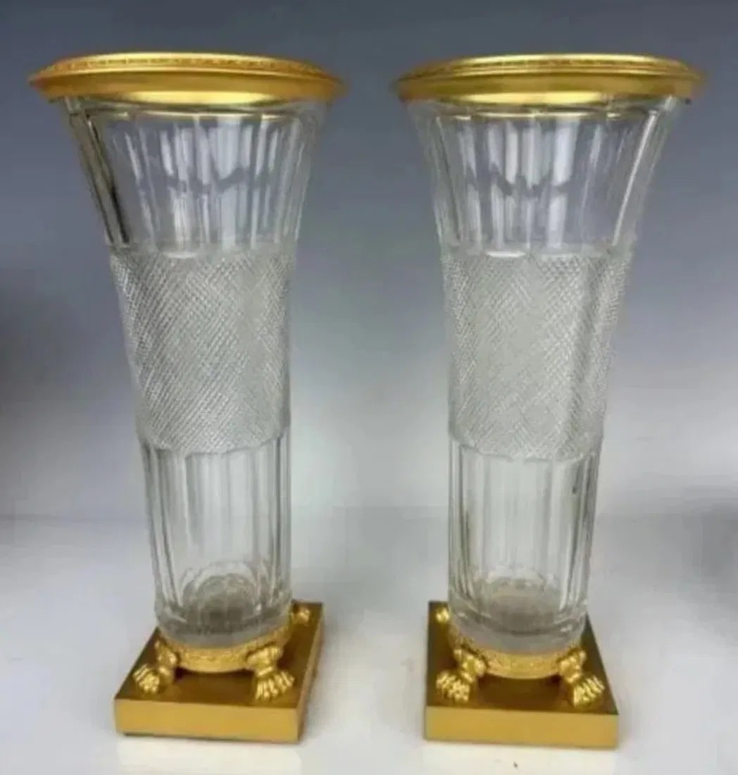 A VERY FINE PAIR OF EMPIRE STYLE DORE BRONZE AND BACCARAT CRYSTAL VASES: Circa 1900. Measure 10 inches high. Stamped on bronze bases made in Austria. Excellent condition.Estimate $2500-3000