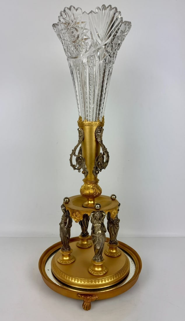 A LARGE EMPIRE STYLE BRONZE AND BACCARAT CRYSTAL VASE: Circa 100. Measures 18 inches high. On an ormolu tray. In good condition. Estimate $2000-3000