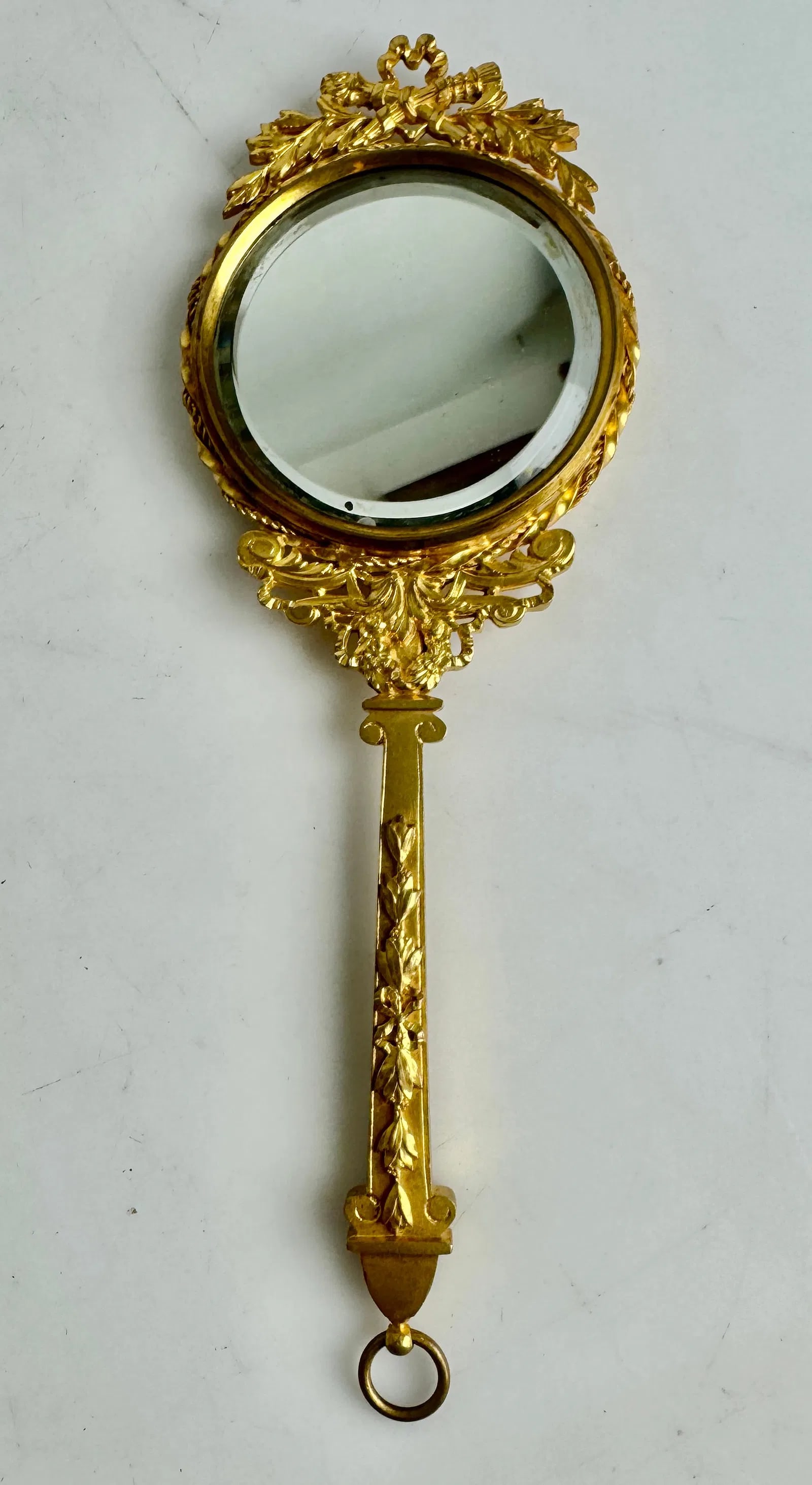 ORMOLU MIRROR: Circa 1900. Measures 10”. In excellent condition. Estimate $400-500