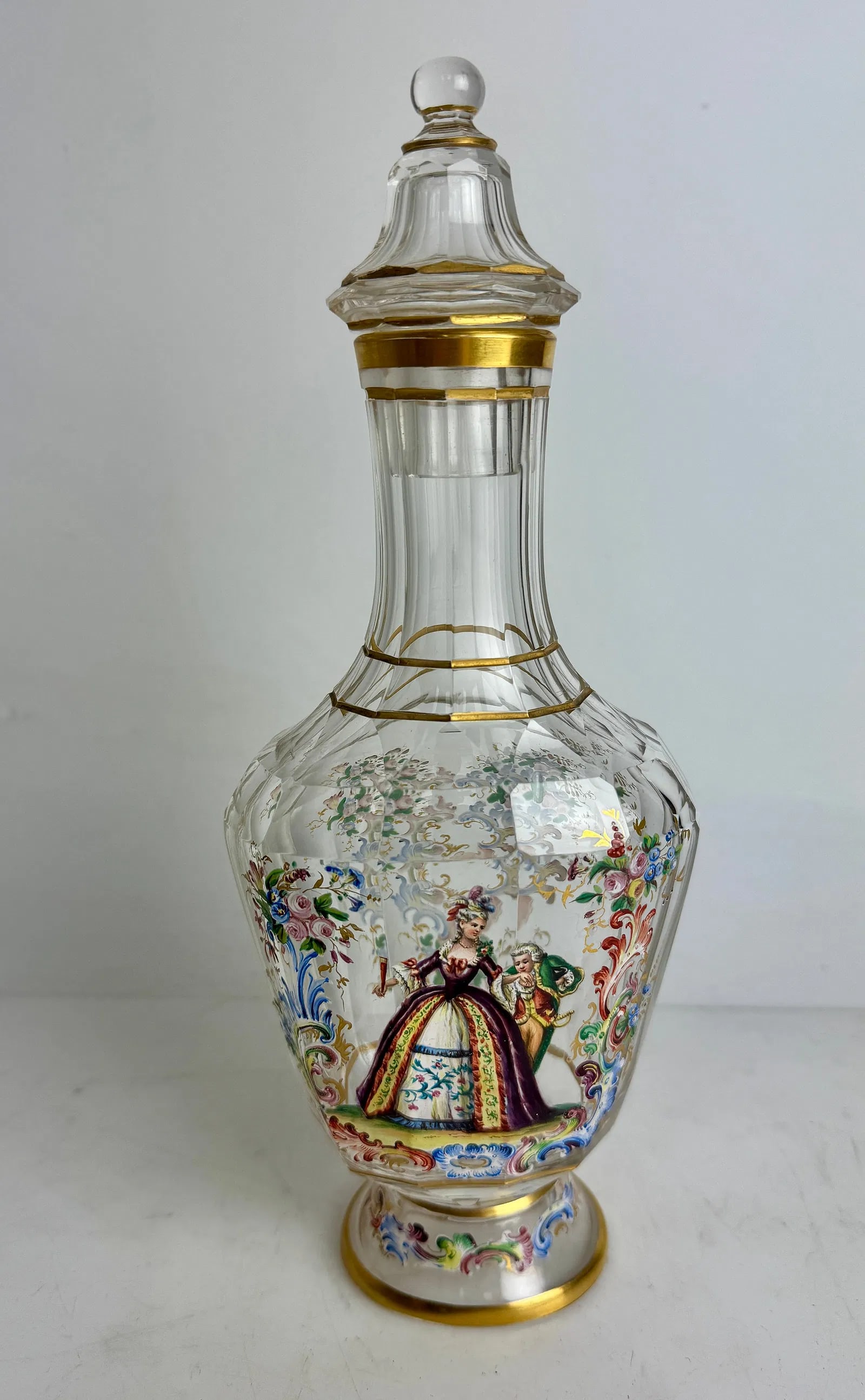 A LARGE ENAMELED LOBMEYR LIQUOR BOTTLE: Circa 1900. Measures 10.5” h. Signed. In excellent condition. Estimate $1500-2000