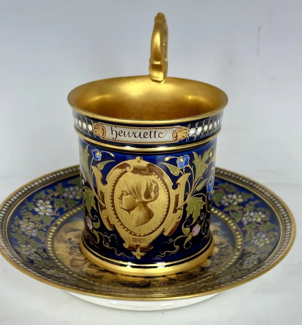 A 19TH C. SEVRES PORCELAIN CUP AND SAUCER: Circa 1849. Saucer measures 6.5 inches d. Cup 6 inches high. By Maximillien Ferdinand Merigot.Estimate $5.000-6.000Work of a famous master (signed), who has devoted more than 30 years to the
