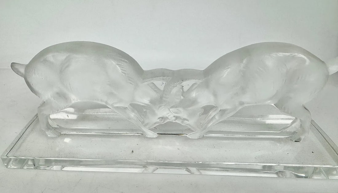 LALIQUE GOATS FIGHTING: Measures 9 inches l. Signed Lalique France. In good condition. Estimate $300-400