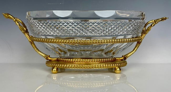 A LARGE DORE BRONZE AND BACCARAT STYLE CRYSTAL CENTREPIECE: Measures 17 inches long, 6.5 inches h. In good condition. Estimate $800-1000