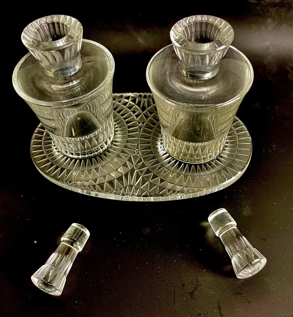 LALIQUE OIL AND VINEGAR BOTTLES: Signed Lalique France . Measures 6 inches h. In excellent condition. Estimate $800-1000
