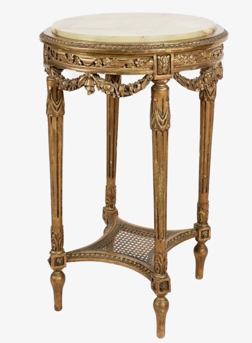 LOUIS XVI STYLE CARVED GILTWOOD GUERIDON: Louis XVI-Style Carved Giltwood onyx top Gueridon, circa 1900. Dimensions: 31 1/2 x 20 in.Estimate $1.200-1.500