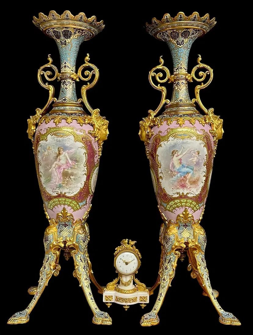 A MAGNIFICENT PAIR OF ART NOUVEAU CHAMPLEVE ENAMEL AND SEVRES: A magnificent palatial pair of CHAMPLEVE enamel mounted Sevres style porcelain vases. Circa 1920. Signed Collot. Measure 78 cm. No damage detected. In overall good condition.Estimate $30.000-40.000
