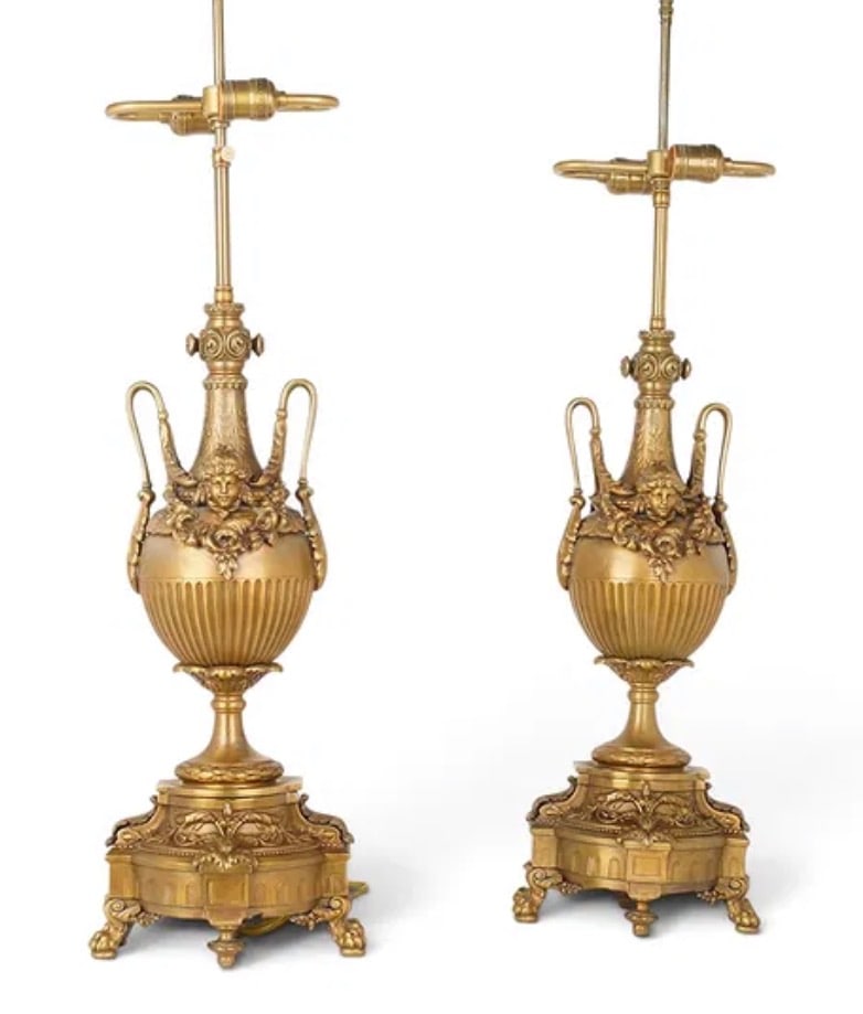 A PAIR OF GILT METAL LAMPS: Circa 1920. Measure 35” high. Estimate $800-1000