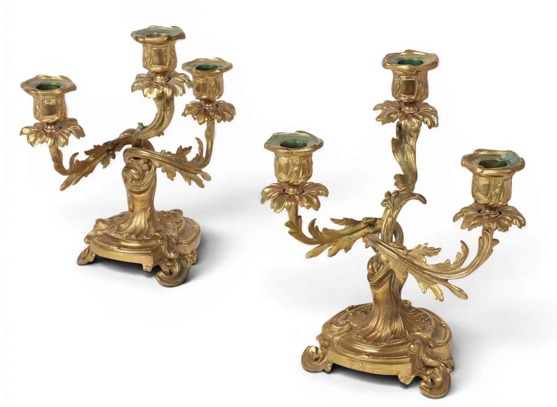 A PAIR OF ORMOLU CANDEL HOLDERS: Circa 1920. Dimensions: height 9 3/4in (25cm); width 8 1/2in (21.5cm); depth 6 1/2in (16.5cm).I excellent condition. Estimate $700-900