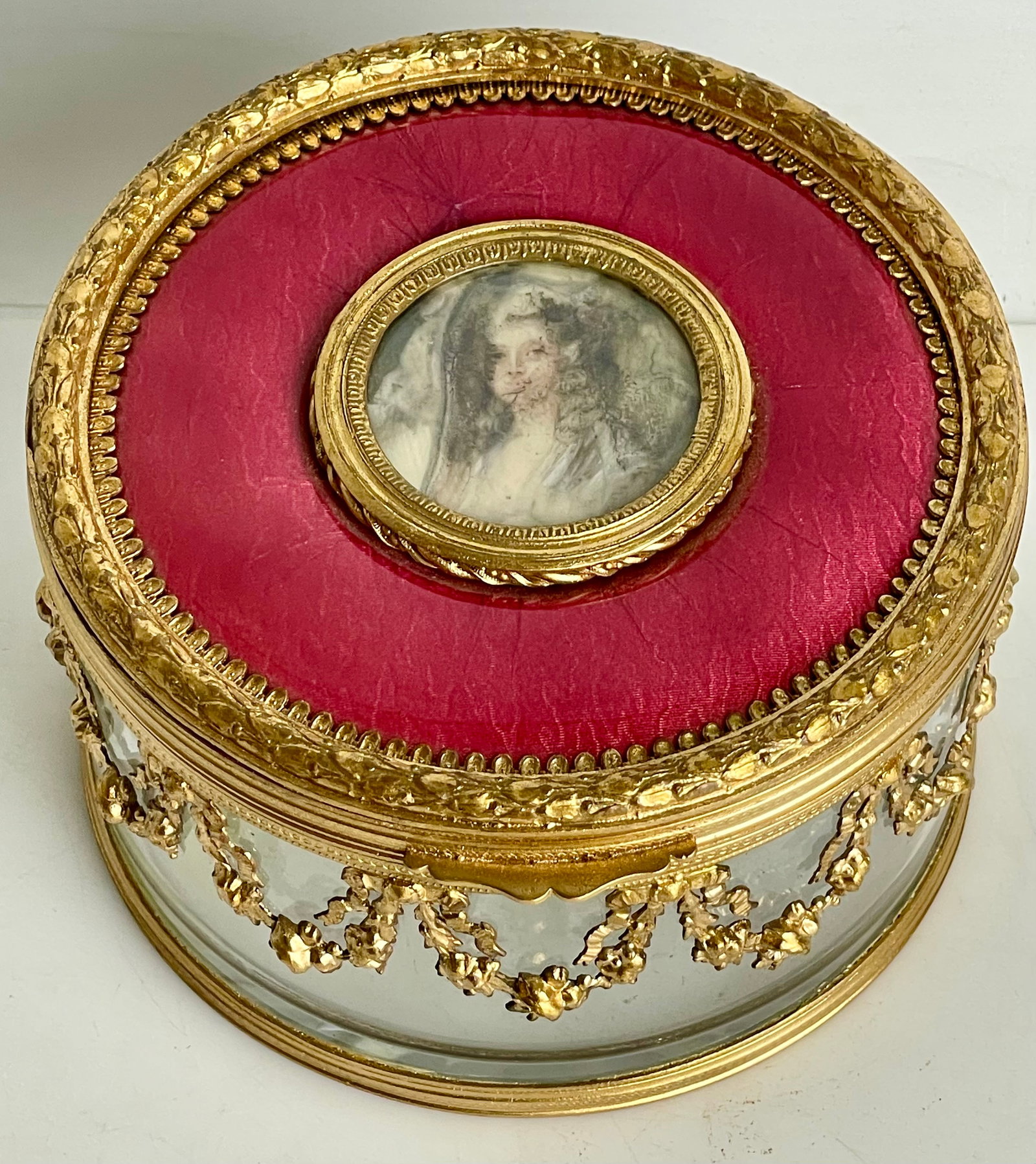 A FRENCH ORMOLU MOUNTED ENAMEL TOP BOX: Circa 1900. Measures 6” d., 5” h. Estimate $600-800