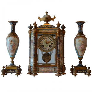 A TIFFANY CHAMPLEVÉ ENAMEL AND SEVRES PORCELAIN CLOCK: Dimensions: clock 15.5 in.Hx8.25 in.Wx6 in.D , vases 13.5" .