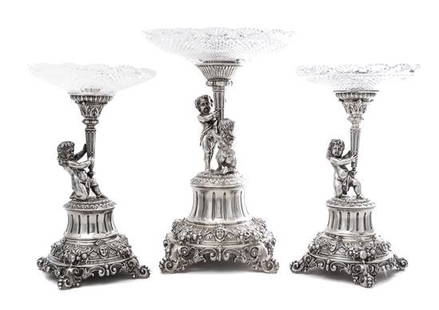 A GERMAN SILVER AND CUT CRYSTAL TRIO GARNITURE: pieces marked 800 with German maker's mark and with Austro-Hungarian import marks for 1891-1901 . Tallest 14" High. 42 ozt 17 dwt weighable. Estimate $3.000-3.500