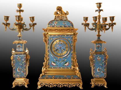 19TH CENTURY CHAMPLEVE ENAMEL CLOCK SET: Clock 21" High.Excellent condition. Estimate $35.000-40.000