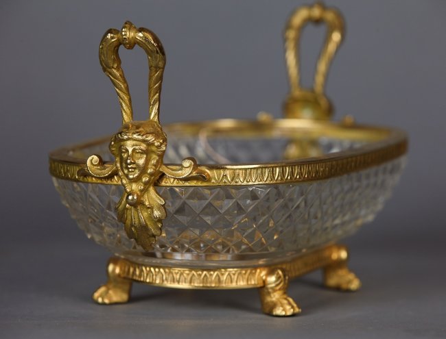 A BACCARAT CRYSTAL AND DORE BRONZE DISH: Measures 6.5" L. In excellent condition. Estimate $400-600