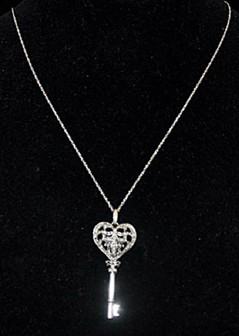 Gorgeous Silver Heart-Cross-Key Shape Necklace with: Gorgeous Silver Heart-Cross-Key Shape Necklace with Diamonds (93I) twt approx. .50ct VS1 Color I.