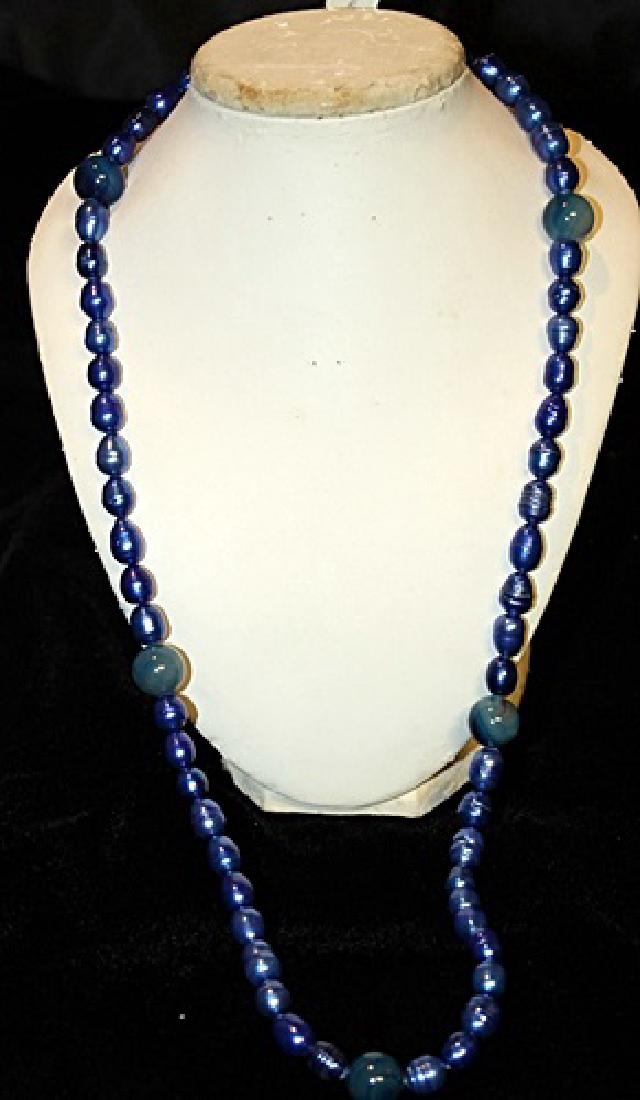Baroque Crystal Dark Lapis Color Pearl Necklace: 24 inch single strand crystal dark lapis color baroque pearl necklace.