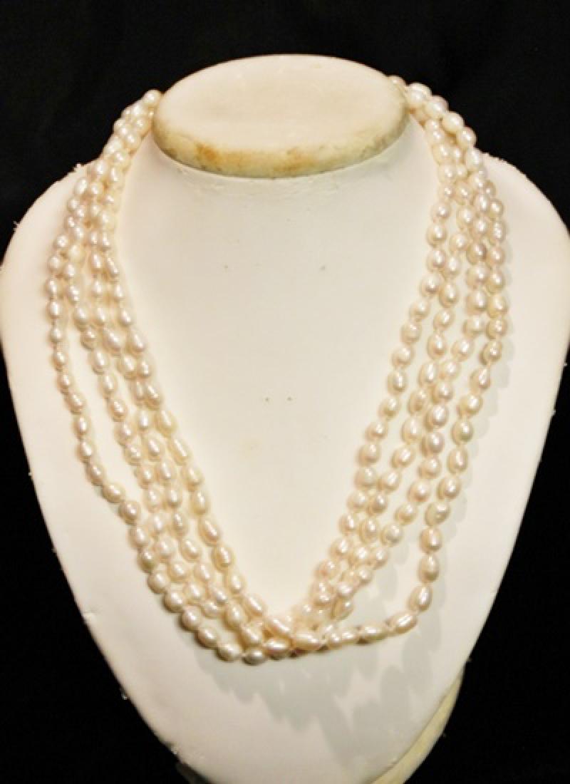 Baroque Ivory Color Pearl Necklace: 20 inch 4 strand ivory color baroque pearl necklace.