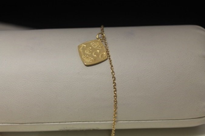 Elegant 14kt Gold over Silver T & Co. Bracelet: Elegant 14kt Gold over Silver T & Co. Bracelet, size approx. 7 in.