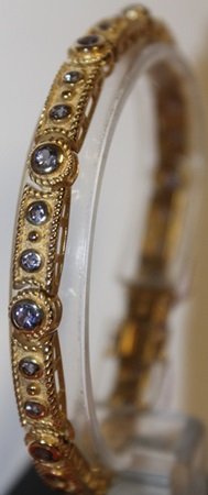 Stylish Gold over Silver Tanzanite Bracelet: 14 ct. Yellow gold bracelet with tanzanite, approx 7 ct. Gold