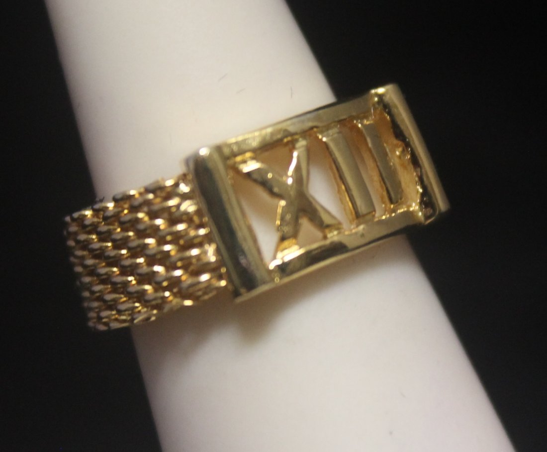 Beautiful 14kt Gold over Silver Roman Numeral Ring: Beautiful 14kt Gold over Silver Roman Numeral Ring; knitted stretchable band.