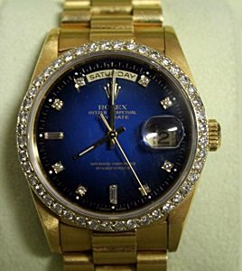 18kt President Rolex Wrist Watch: 18Kt Gold, Presidential Rolex Watch, Diamond Dial, Diamond Face, Blue Face (Sapphire), Oyster Perpetual, DayDate Rolex Wrist Watch, Comes with Papers.